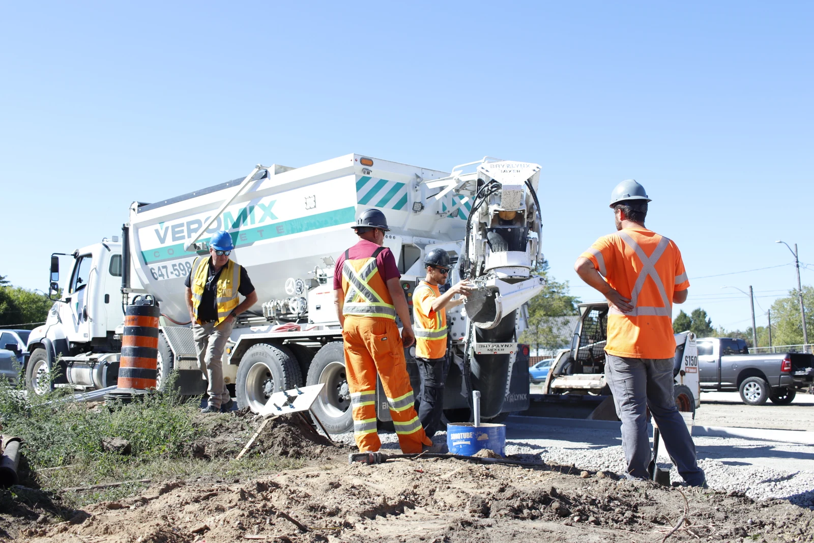 Volumetric concrete mixer producing concrete on site