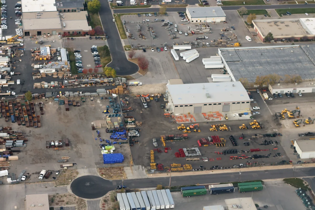 Equipment rental yard with a fleet of construction machinery