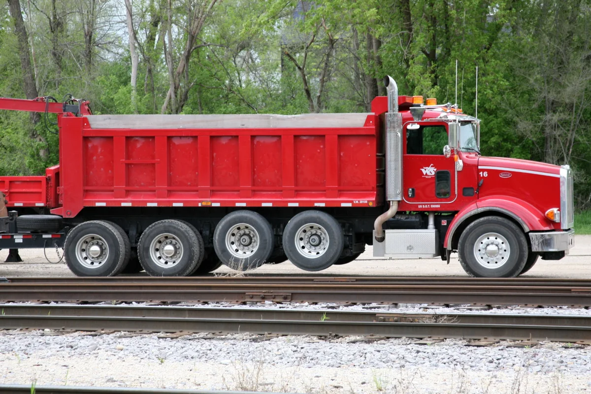 Red Peterbilt dump truck used for material hauling